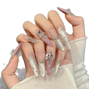 Pink and silver gradient stiletto press-on nails with luxury rhinestones and cat-eye finish