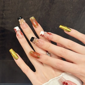 Handmade coffin nails with pink floral carvings, golden relief texture and amber finish