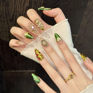 Baroque style press-on nails with green metallic finish and 3D angel relief patterns