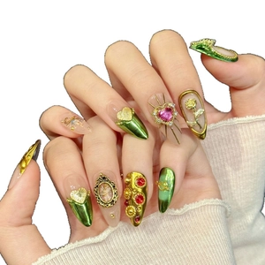 Baroque style press-on nails with green gold relief, angel relief and pink heart gems