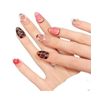 Pink cat eye press-on nails with leopard print and 3D floral relief design