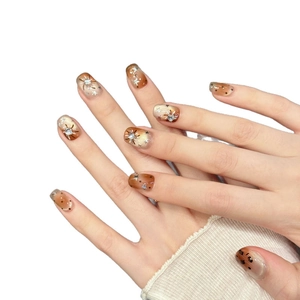 Cat eye star press-on nails with brown gradient and rhinestones in short square shape