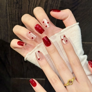Handmade burgundy and cat-eye white press-on nails with red heart details in square-oval shape