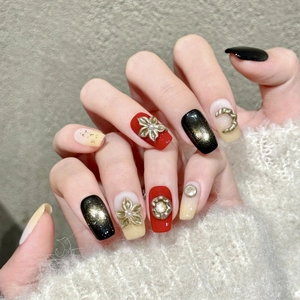 Handmade press-on nails with gold accents, cat-eye glitter, and retro 3D floral designs