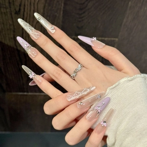 Faux ongles faits main œil de chat rose violet avec nœud et strass forme amande