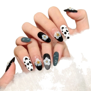 Handmade press-on nails with 3D white flowers, cow print patterns and grey glossy finish