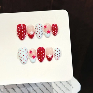 Handmade red and blue polka dot star press-on nails set with glossy finish