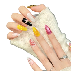Handmade pointed almond press-on nails with leopard print and floral 3D accents