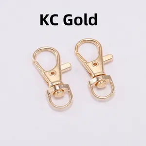 Close-up of two KC Gold swivel lobster claw clasps for DIY keychain making