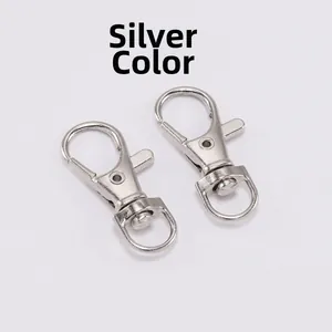 Macro view of rhodium color metal lobster clasps with 360-degree rotating ring for DIY crafts