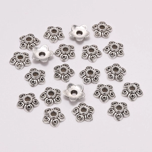 Retro silver star-shaped flower bead caps with spiral pattern and central hole for DIY jewelry