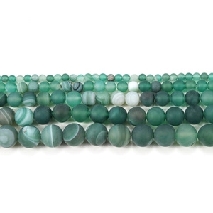 Macro shot of matte aquamarine and agate beads in various sizes for DIY jewelry