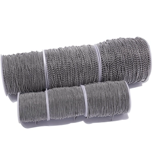 Silver ball chain bead rolls in various sizes on white spools for DIY jewelry making