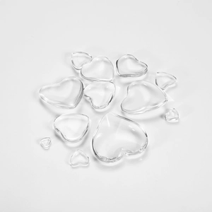 Top view of clear heart-shaped glass cabochons in various sizes for DIY jewelry crafts