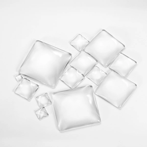 Macro shot of assorted square clear glass cabochons for DIY jewelry making
