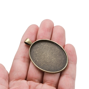 Base pendente ovale in bronzo antico con texture a nido d'ape per gioielli fai da te