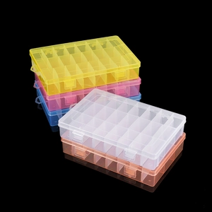 Stack of 24-grid transparent plastic storage boxes in yellow, pink, blue, white, and orange