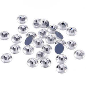 Macro detail of white round glass rhinestones with flat bottom for DIY crafts