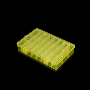 Detail view of the yellow semi-transparent 24-compartment storage box with double buckles