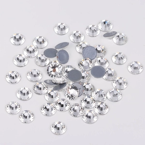 Macro shot of white glass flatback rhinestones with silver coating for DIY crafts