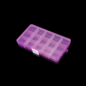 Macro view of a 15-grid pink translucent plastic storage box with secure white buckle