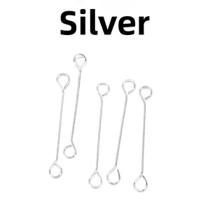 Detail of silver DIY jewelry eye pins with closed loops on white background