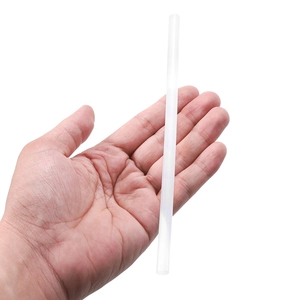 White semi-transparent hot melt glue stick held in hand to show the 7x180mm scale