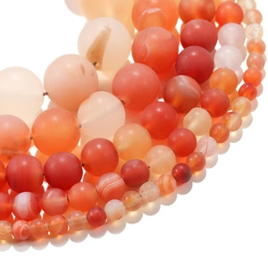 Macro detail of natural white turquoise beads in various sizes for DIY jewelry making
