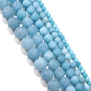 Frosted aquamarine beads in various sizes for DIY jewelry making on white background