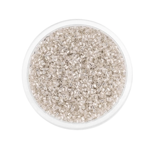 Close-up of 2mm silver glass seed beads neatly packed in a clear round container