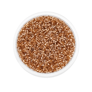 Detailed macro view of 2mm golden bugle beads in a clear round storage container