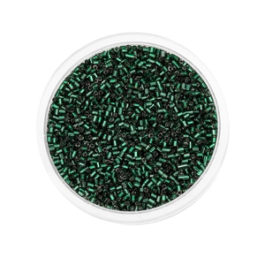 Macro detail of 2mm green metallic glass bugle beads in a transparent container for DIY crafts
