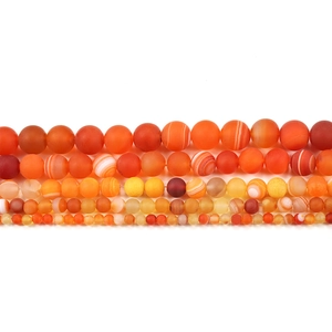 Frosted orange-red striped agate beads in various sizes from 4mm to 12mm on white background