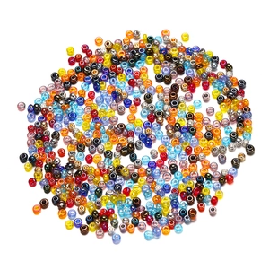 Mix of 2mm colorful glass seed beads for DIY jewelry making on white background