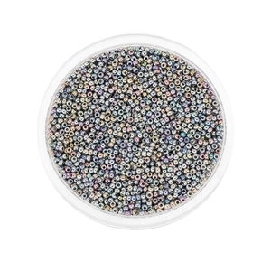 Macro shot of 2mm rainbow glass seed beads with metallic sheen in a transparent box