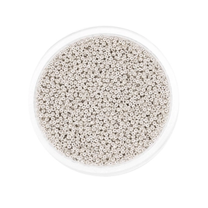 Detailed top view of silver glass seed beads packed in a round clear storage container