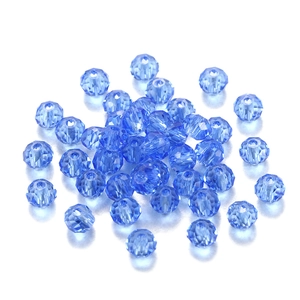 Macro detail of light blue faceted crystal glass beads for DIY jewelry making