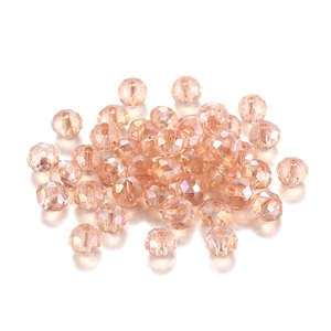 Close-up of champagne gold faceted crystal beads with iridescent coating for DIY jewelry