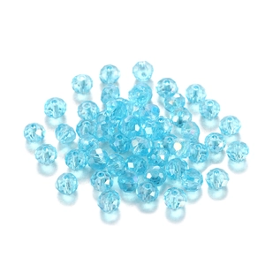 Macro view of transparent blue faceted crystal beads for DIY jewelry making and crafts
