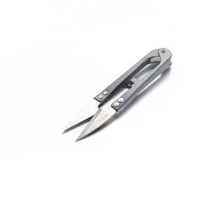 Macro shot of U-shaped thread snips with steel blades and grey matte alloy handles
