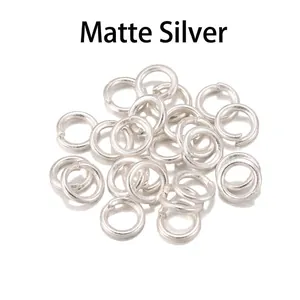Matte silver jump rings for DIY jewelry making connecting parts on white background