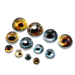Detailed collection of assorted glass cat eye cabochons for jewelry and doll making