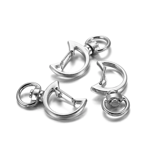 Detailed view of silver crescent moon-shaped lobster clasps for DIY keychains and jewelry