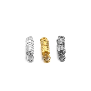 Macro detail of screw barrel clasp connectors for DIY jewelry making in three metallic colors