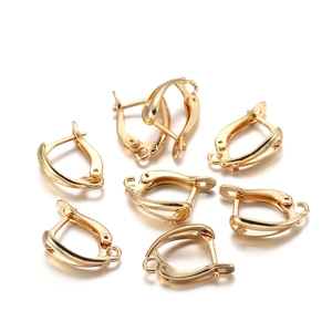 Detailed view of seven gold-plated leverback ear hooks for DIY jewelry earring making