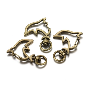 Detail of dolphin-shaped lobster clasps in antique bronze metal with rotating ring
