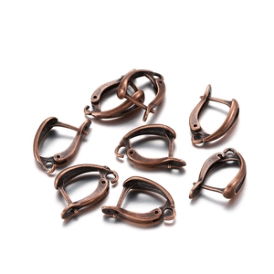 Detailed close-up of retro copper lever back earring hooks for DIY jewelry making