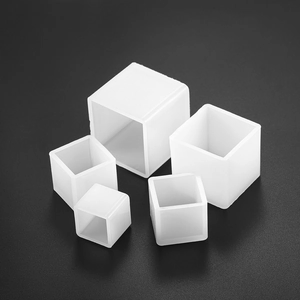 Five assorted sizes of translucent silicone square furniture leg protectors on black background
