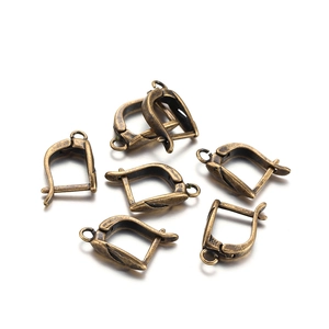 Macro detail of antique bronze French ear hooks for DIY earring making projects