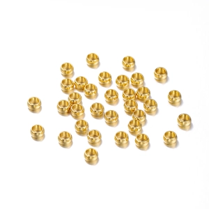 Golden stainless steel spacer beads for DIY jewelry making in a bulk flat lay arrangement